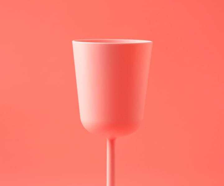 Glass of a glass on a pink background